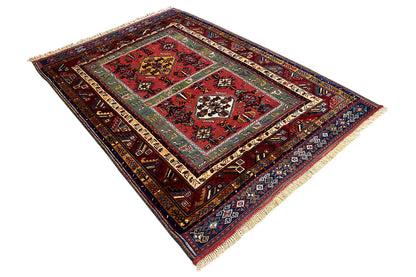 Oriental rug with diamond-shaped medallions, multicolored border design, and fringes