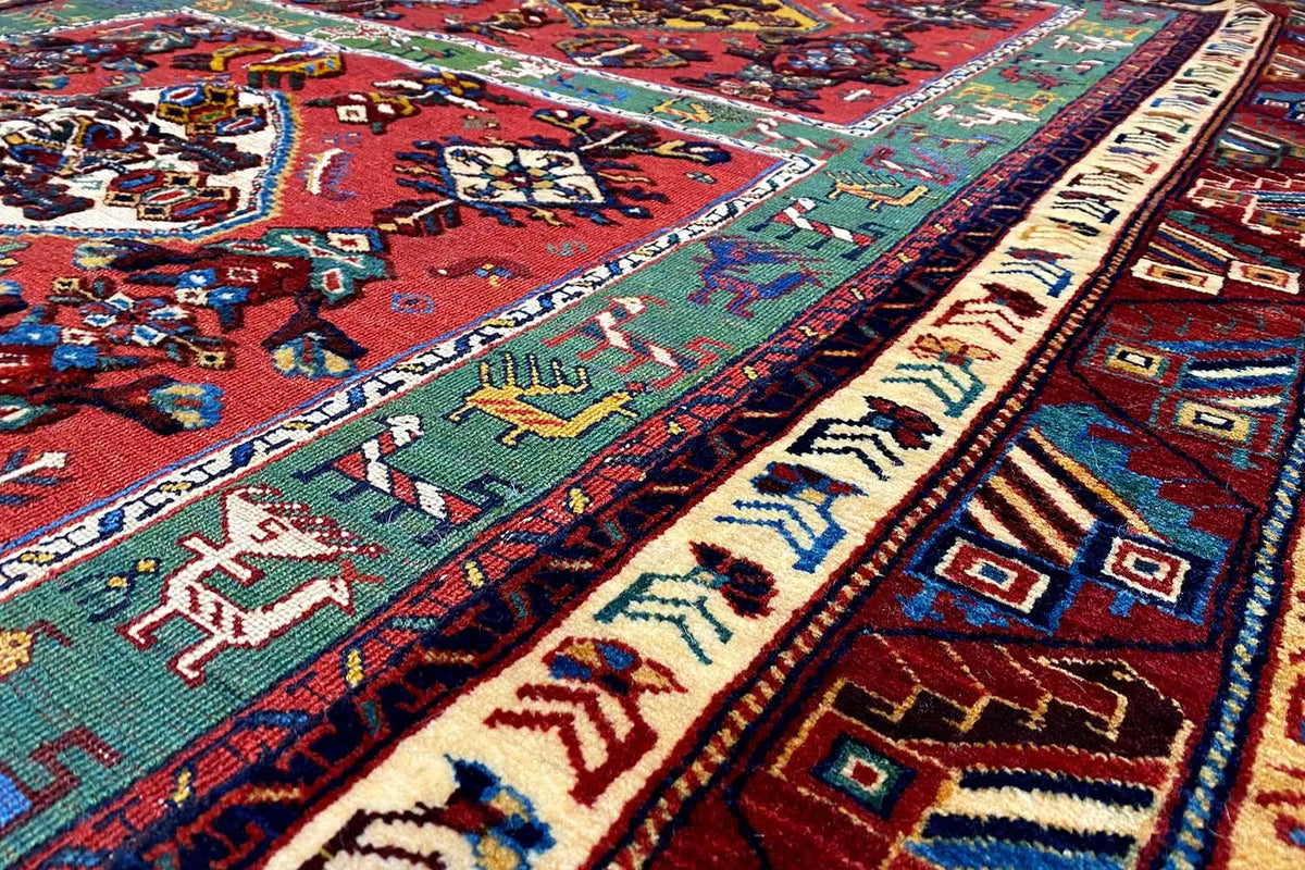 Detail of an oriental rug with colorful ornaments and dense pile