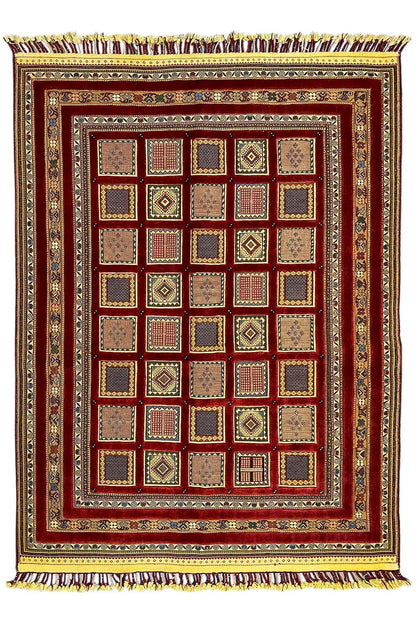 Rug with a red center and beige-brown checkered pattern, gold-colored border, fringes