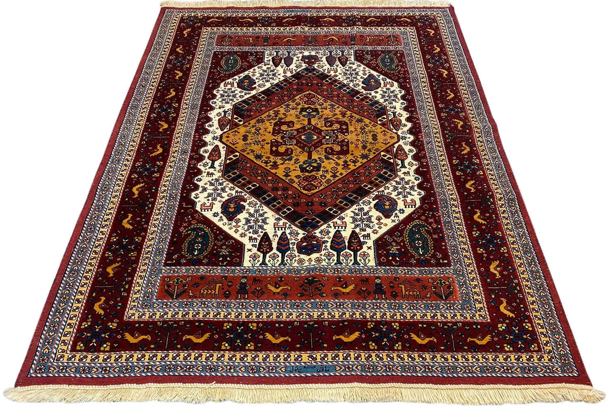 Soumak rug with a red background, geometric border design, and fringes