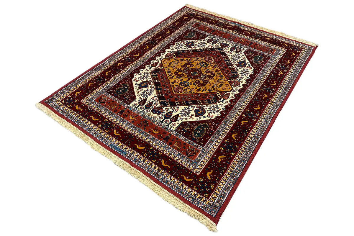 Soumak rug at an angle with a red patterned border, medallion field, and fringe