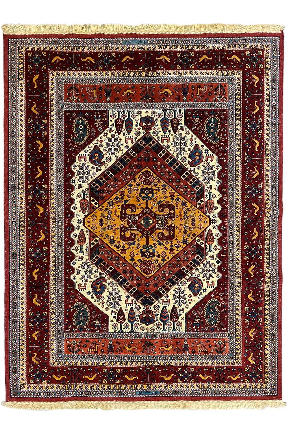 Soumak rug with a red medallion pattern and fringes along the edge