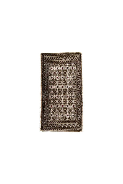 Small-format Turkmen carpet: geometric ornaments in brown, beige, and white