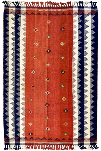 Rug 225x153 cm with an orange central field, striped sides, and a fringed border