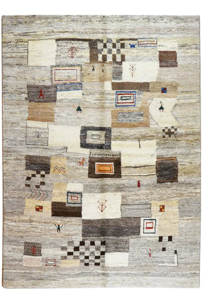 Rectangular rug with an abstract block pattern in beige, gray, and dark accents