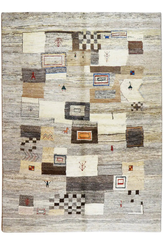 Rectangular rug with an abstract block pattern in beige, gray, and dark accents
