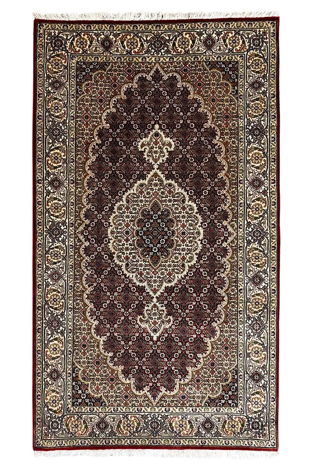 Indo-Tabriz rug: rectangular border design with a dark medallion