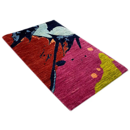 Gabbeh rug 89x60 cm with an abstract pattern in pink, red, blue, and yellow