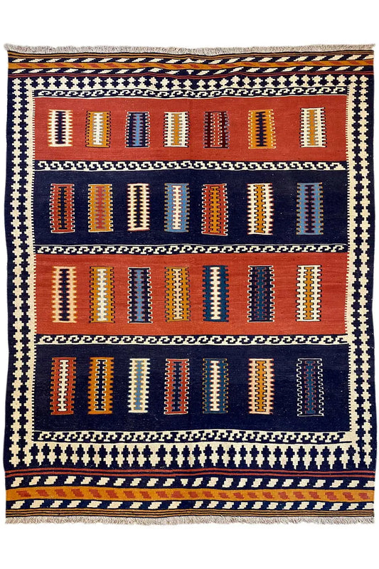 Kilim rug with a grid of diamonds and columns, dark blue, orange, and cream
