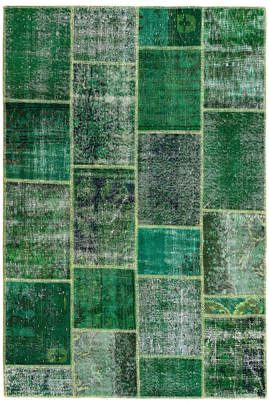 Patchwork rug: green and beige patchwork pattern in many rectangles and squares.