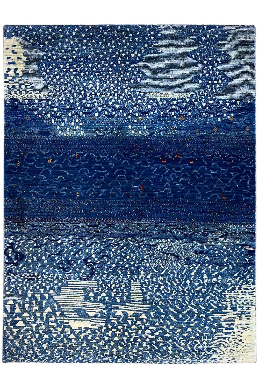 Gabbeh rug with a geometric blue-and-beige pattern and dark central stripe