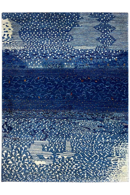 Gabbeh rug with a geometric blue-and-beige pattern and dark central stripe