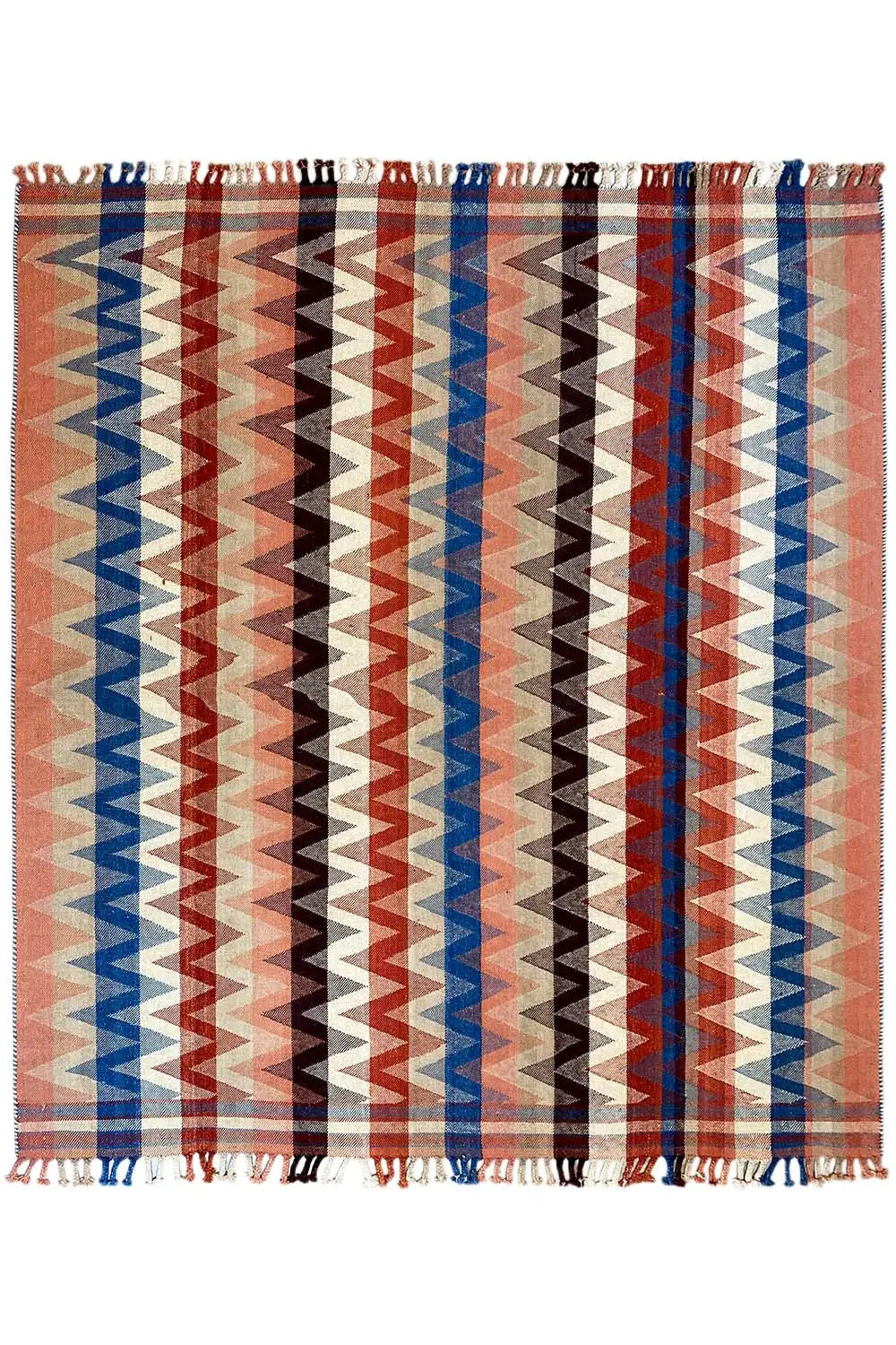 Terracotta rug with wide blue and brown zigzag stripes, fringes