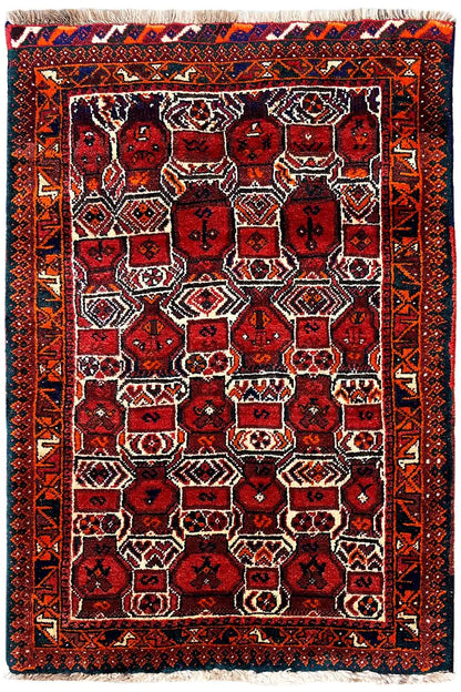 Bordeaux oriental rug with a rectangular frame and multicolored tile design