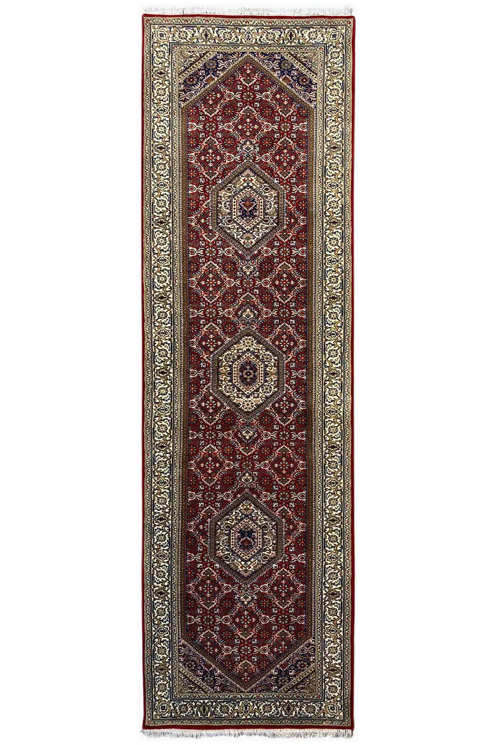 Bidjar runner, elongated rectangular: red central field with medallions and a silvery patterned border