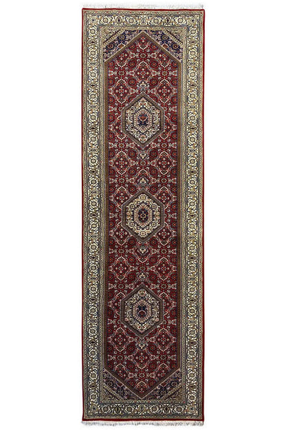 Bidjar runner, elongated rectangular: red central field with medallions and a silvery patterned border