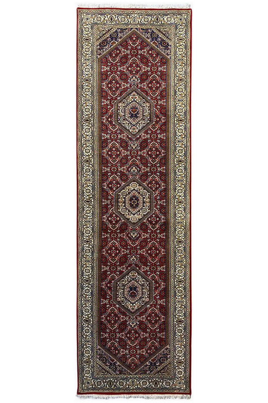 Bidjar runner, elongated rectangular: red central field with medallions and a silvery patterned border