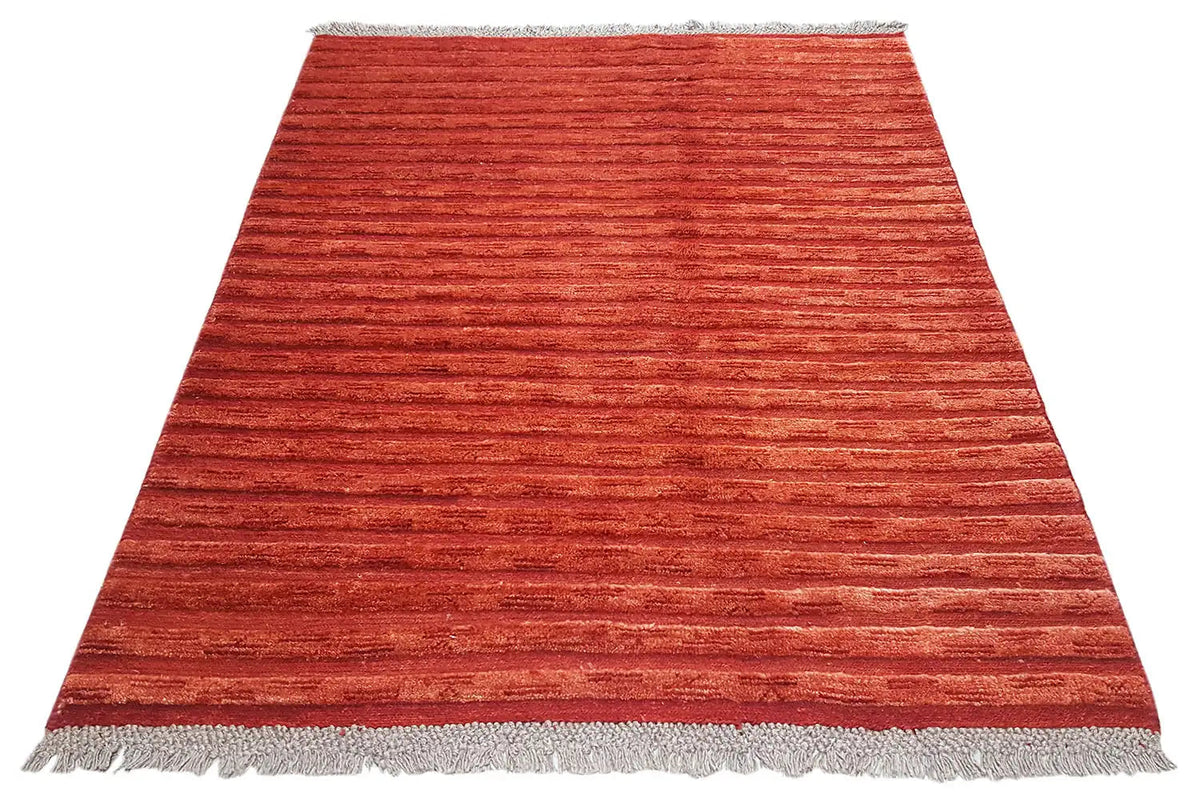 Red-brown Gabbeh rug with fine horizontal stripes and fringes