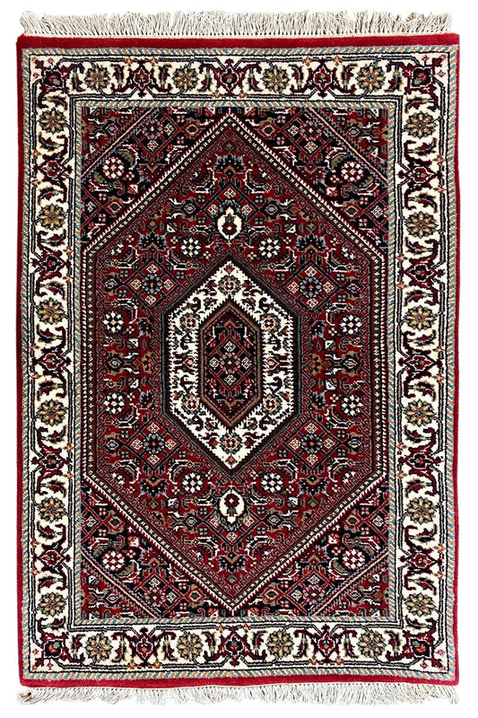 Bidjar rug 94x61 cm with red central medallion, beige border and fringes