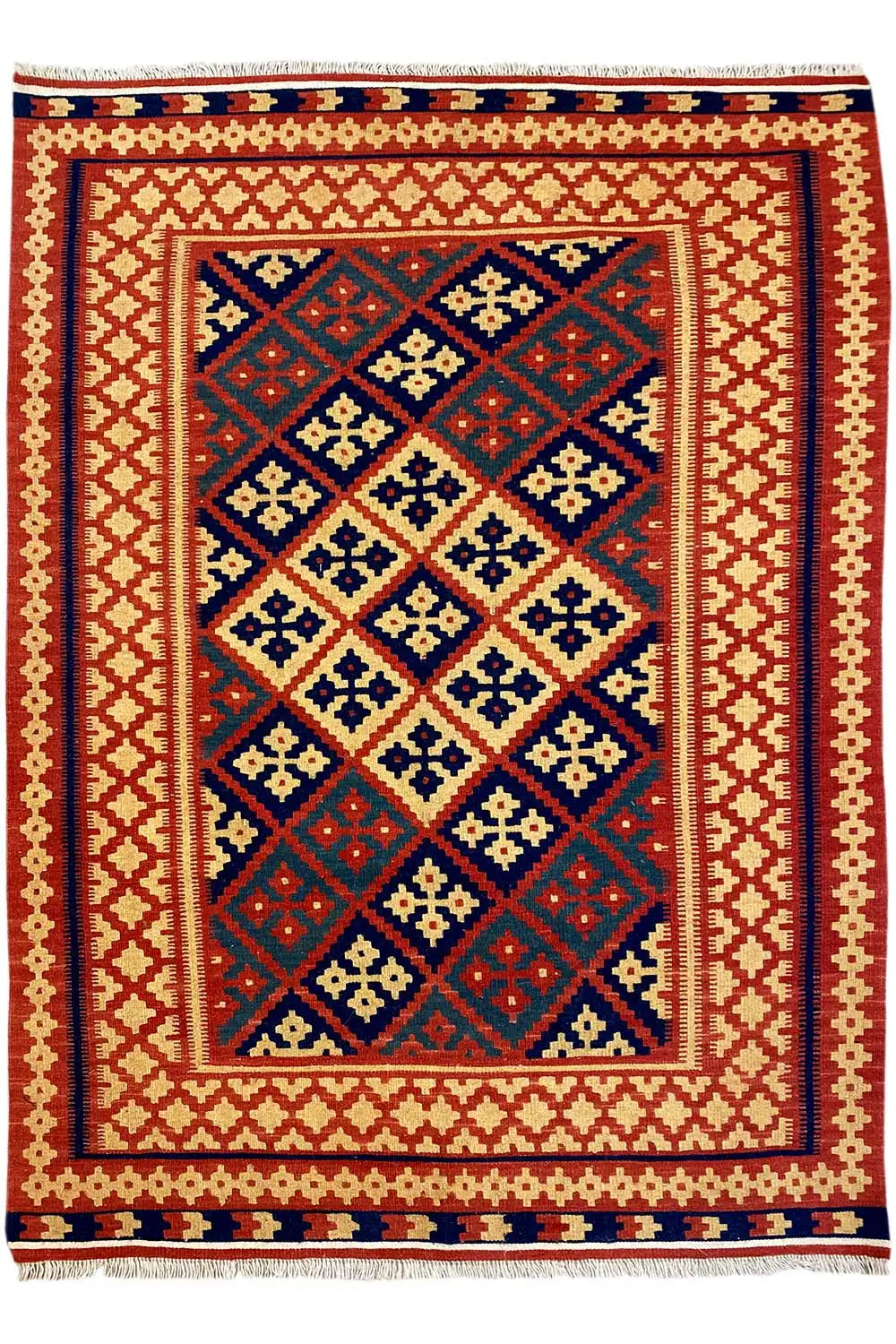 Kilim rug with a rectangular medallion in the central field, shades of red and blue, fringes at the bottom