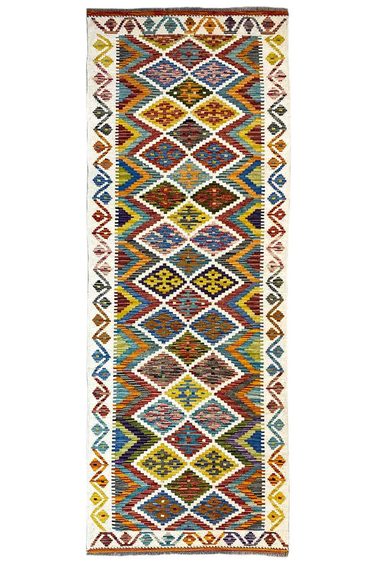 Afghan kilim runner with a geometric diamond and zigzag pattern in bright colors