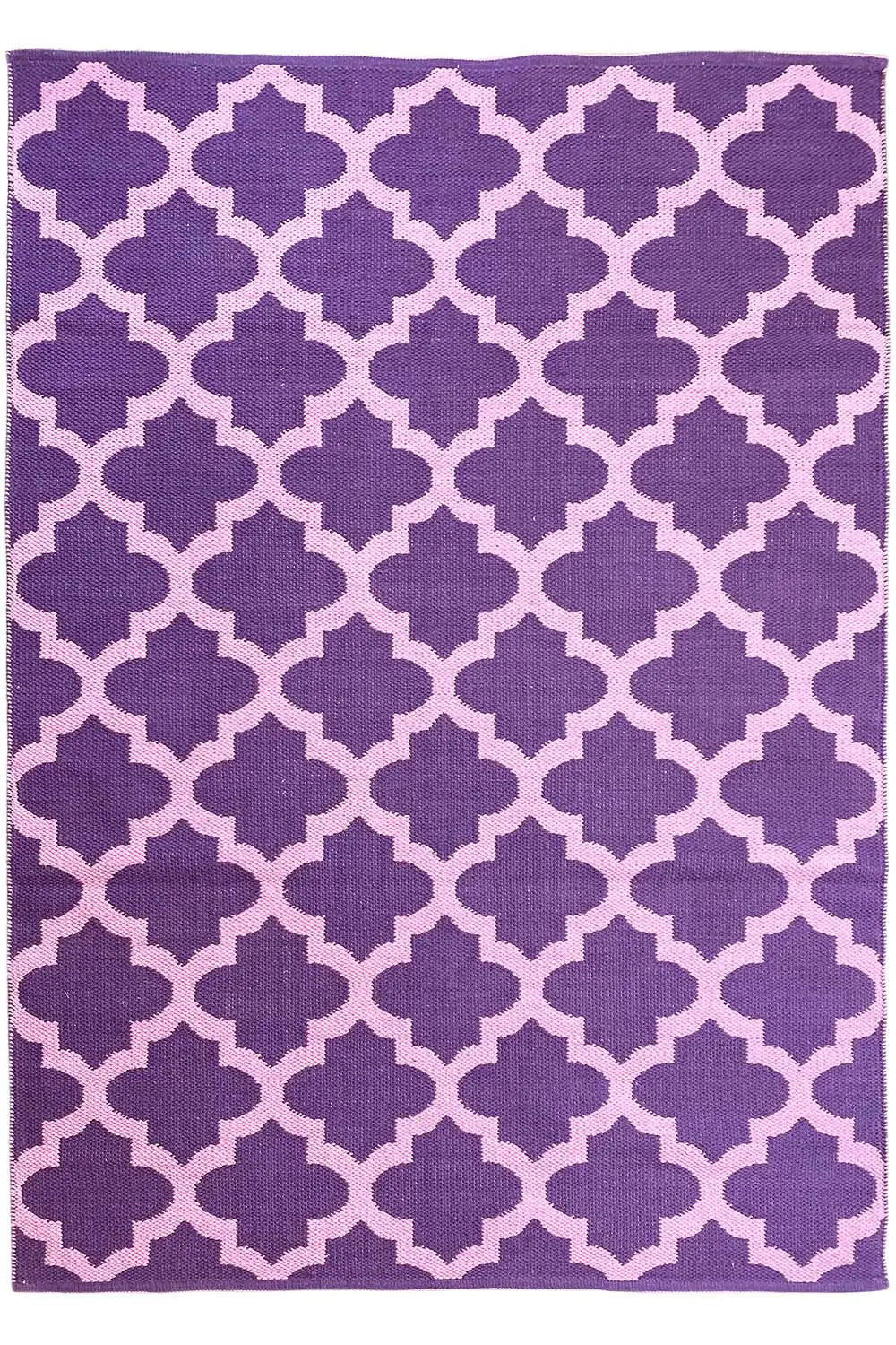 Rectangular rug with a purple background and a geometric quarter-flower pattern in violet