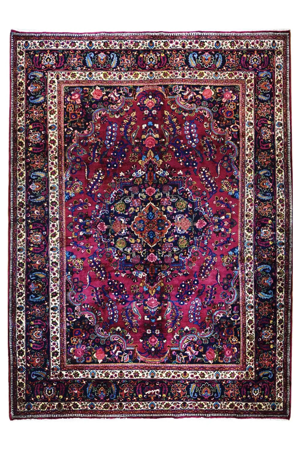 Khorasan rug with red medallion, blue border, and ornamental pattern