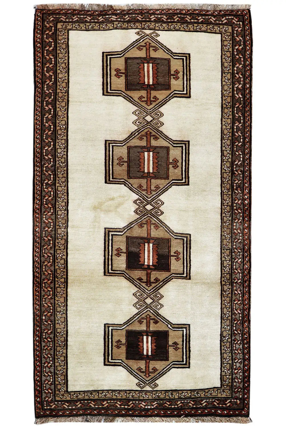 Oriental rug with a beige field, brown decorative border, and four medallions in a row.