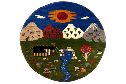 Round Gabbeh rug (101×101 cm) with a colorful landscape motif and fringed edges