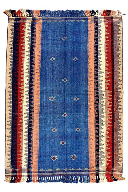 Rug with a central blue stripe and surrounding red, beige, and white stripes