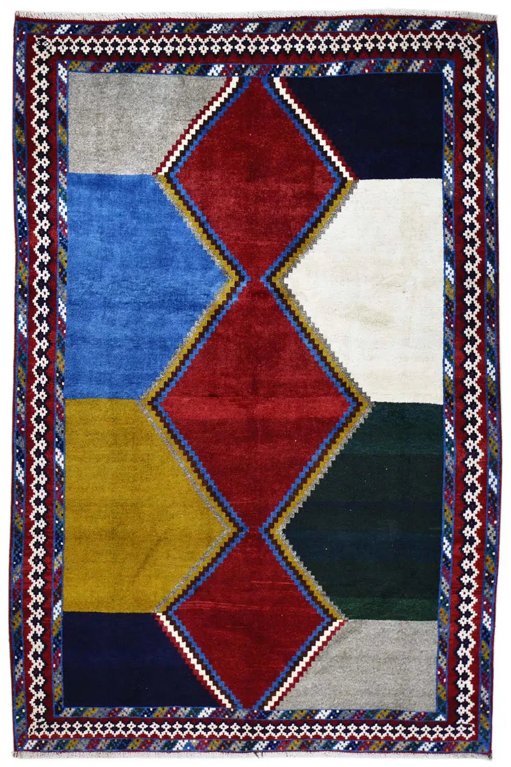 Rug with a geometric diamond design in red, blue, yellow, beige, and a dark border