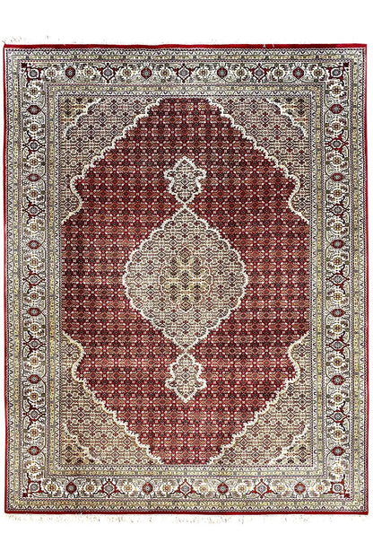 Rug with a maroon square medallion, beige background, and delicate border.