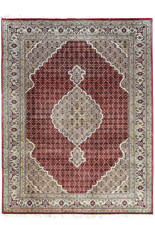 Rug with a maroon square medallion, beige background, and delicate border.