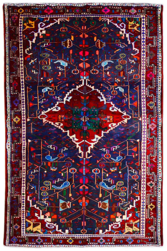 Almost square Hamadan rug with a dark blue pattern, red accents, and a border.