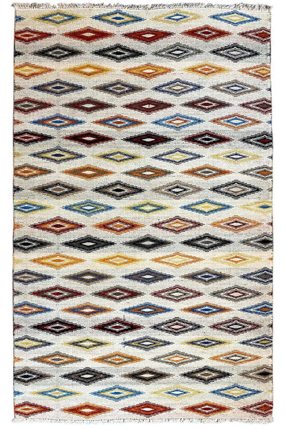 Rectangular kilim dhurrie rug with multicolored diamonds and zigzags on a light background