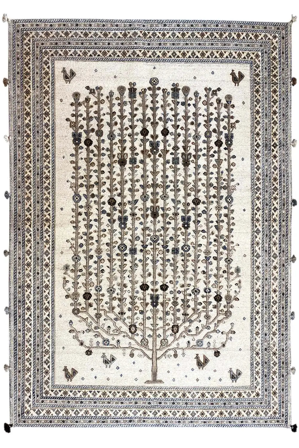 Rug front: light beige background, tree motif with small symbols and layered border