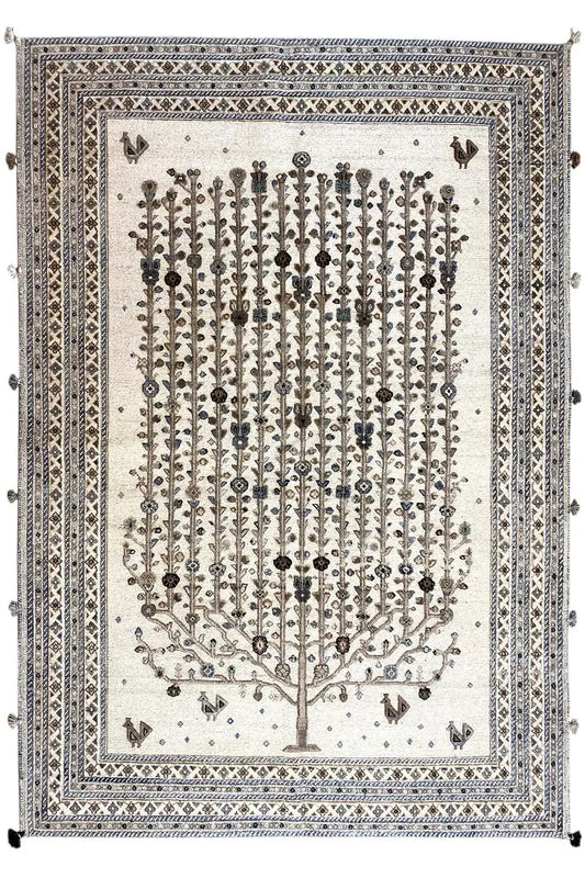 Rug front: light beige background, tree motif with small symbols and layered border