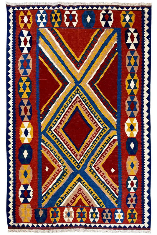 Square kilim rug with a red X motif framed by geometric triangles