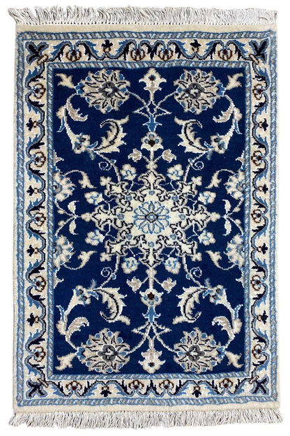 Oriental rug 84x58 cm with blue-and-white ornamentation, fringes along the edges