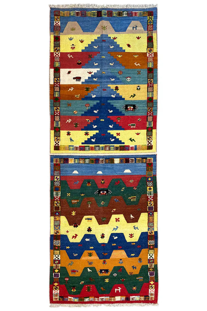 Long kilim runner with colorful animal, house, and ornamental patterns