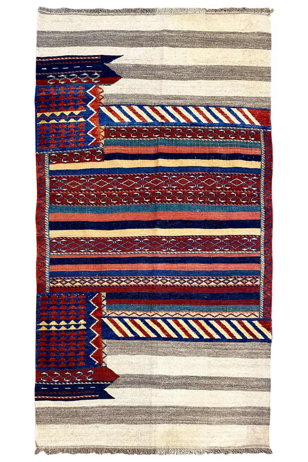 Bakhtiari rug with border patterns of stripes and zigzags in blue, red and beige, fringes
