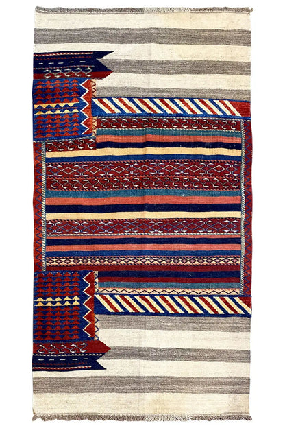 Bakhtiari rug with border patterns of stripes and zigzags in blue, red and beige, fringes