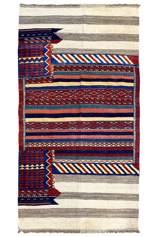 Bakhtiari rug with border patterns of stripes and zigzags in blue, red and beige, fringes