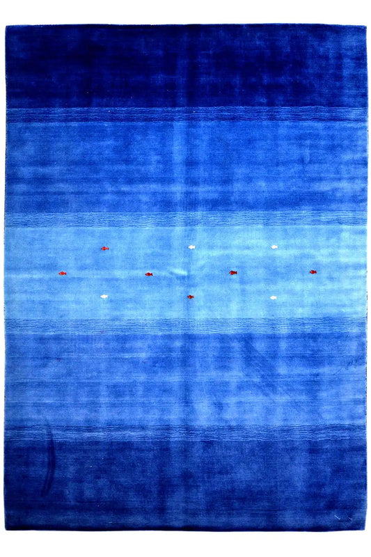 Blue Gabbeh rug with a dark border, horizontal bands of color, and small colorful dots