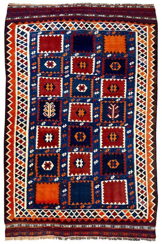 Kilim rug with a blue medallion pattern, red and orange accents, and a border all around.