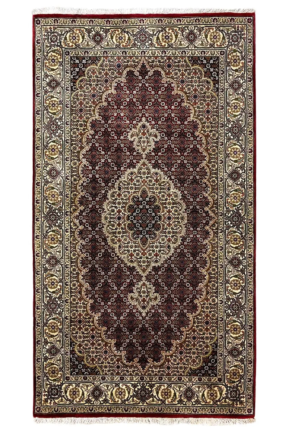 Rectangular rug with a central medallion in dark brown and cream, framed by a border