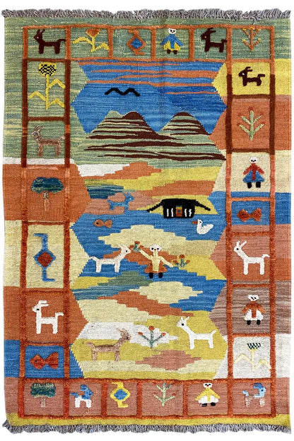 Kilim Qashqai rug with a central landscape, green and blue areas, and colorful border motifs