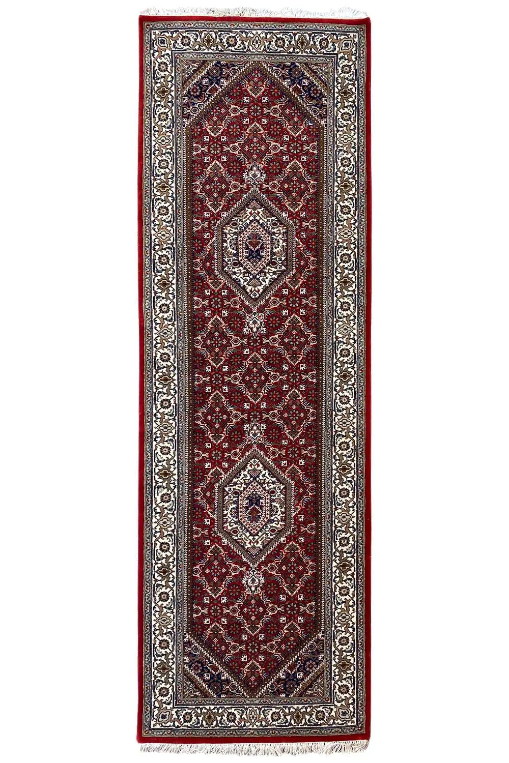 Rectangular Bidjar runner with a red central field, silver-gray border, and fringes.