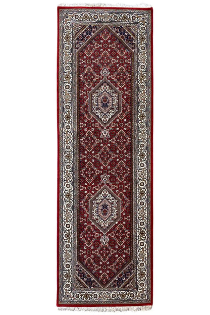 Rectangular Bidjar runner with a red central field, silver-gray border, and fringes.