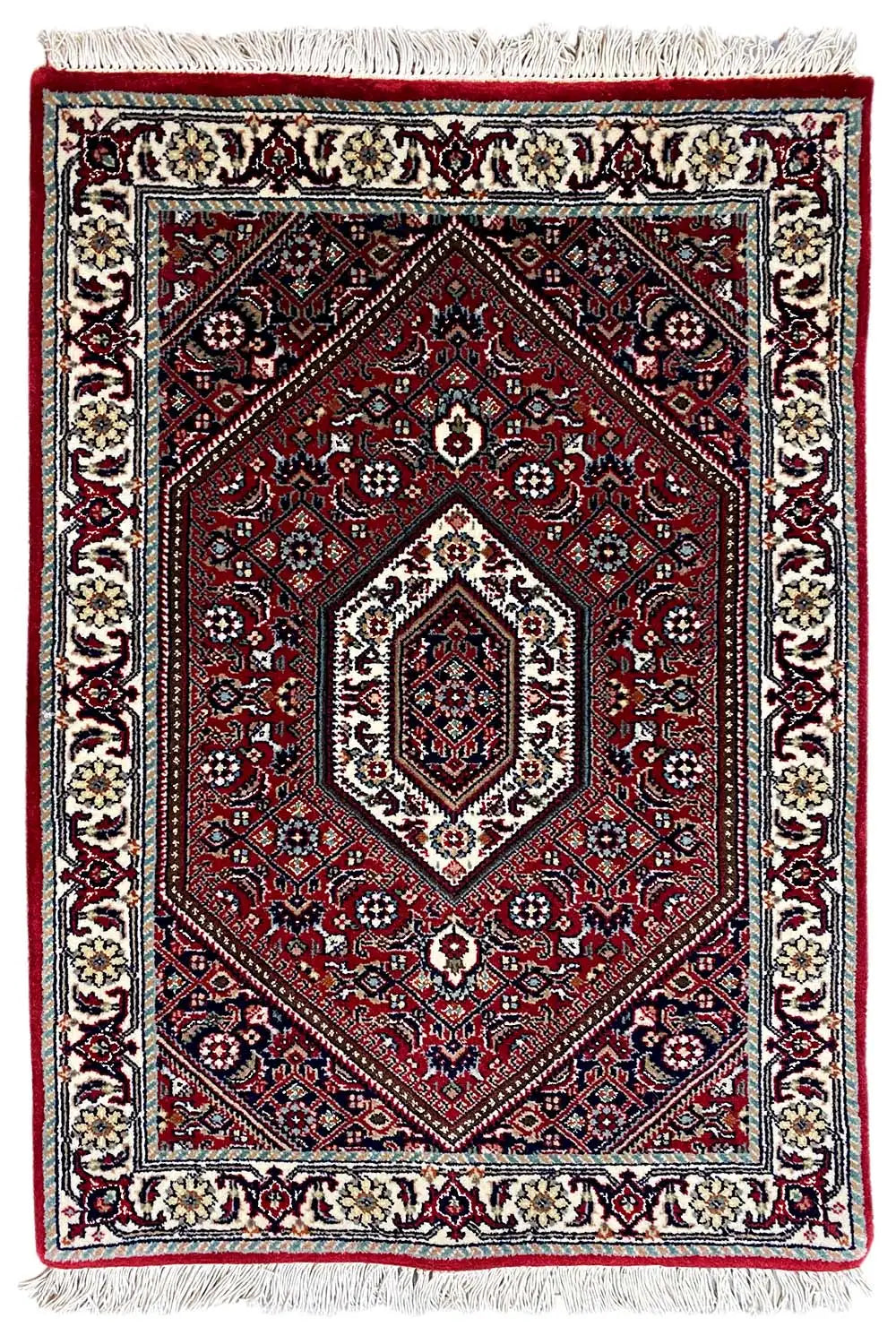 Rug (92x60 cm), red with medallion pattern and cream-colored borders, fringes